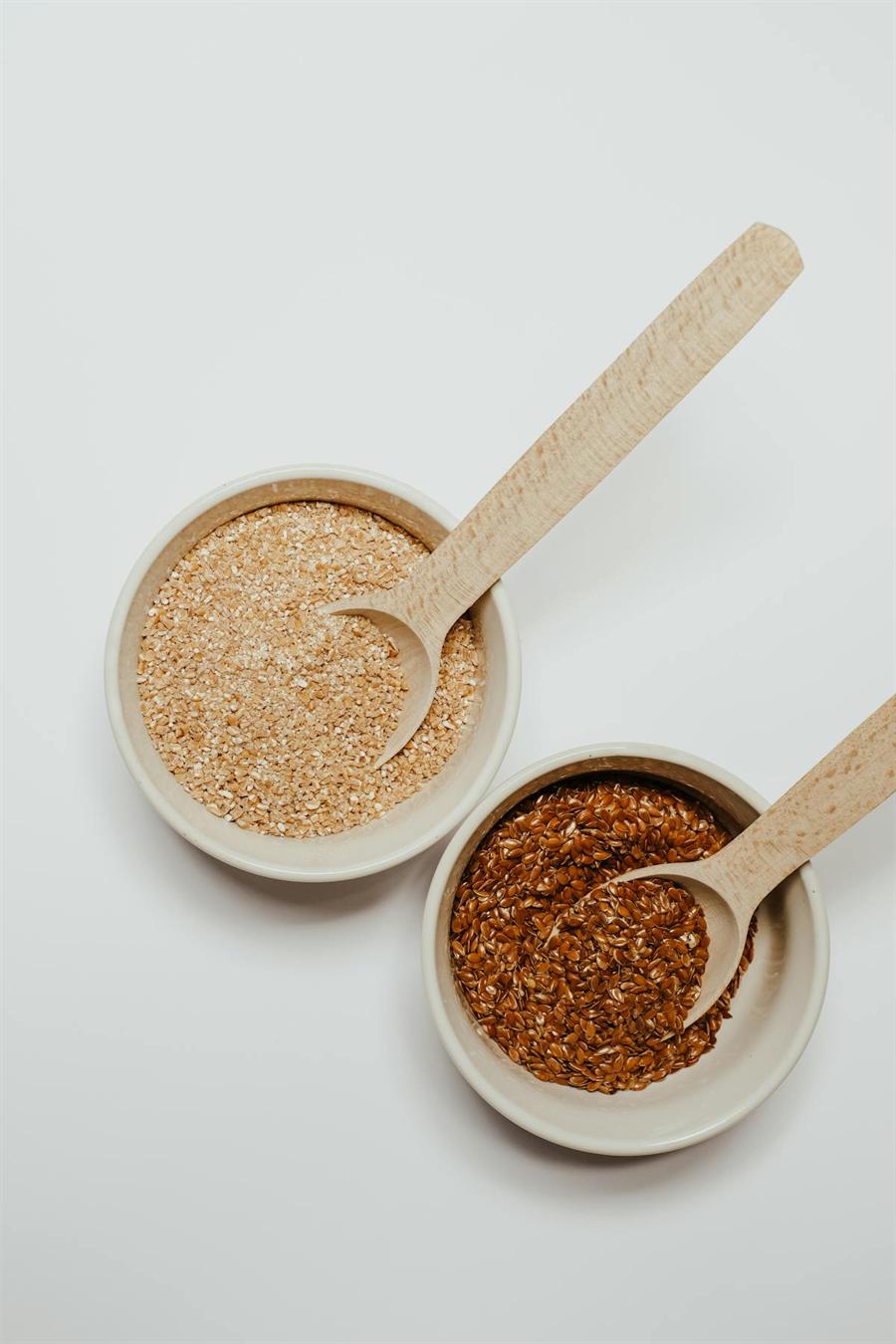 Flax seeds in a bowl on a light background