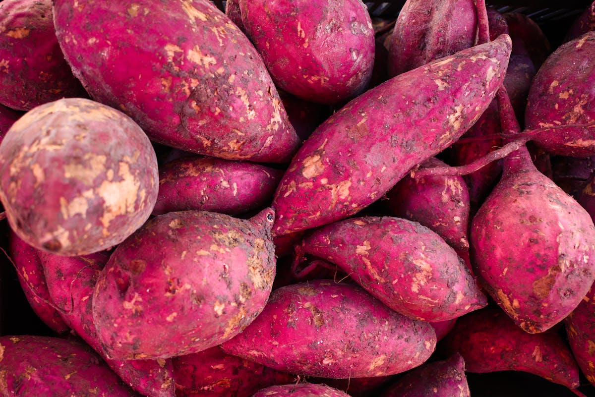 Sweet potatoes on a light background